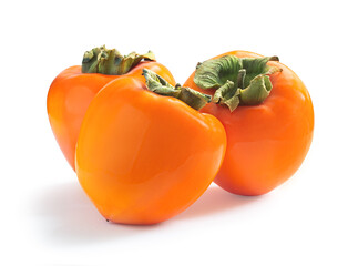 Three ripe juicy sweet persimmons isolated on white