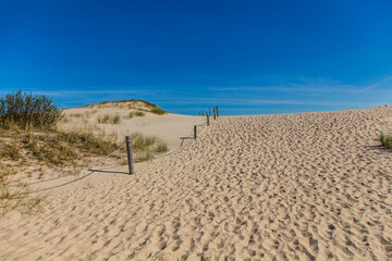 Dunes in the Slowinski National Park. Landscape with beautiful sky, clouds and dunes in the sun in Leba.