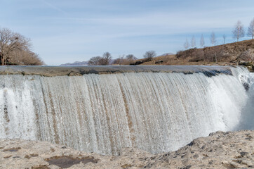 Scenic view of water flowing in dam