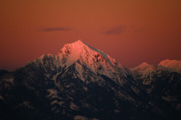 Fototapeta na wymiar Storzic mountain in red sunset in Slovenia