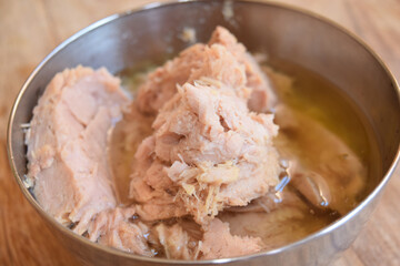 tuna in oil in a metallic salad bowl