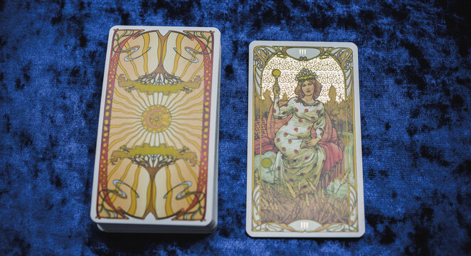 Golden classical Tarot card on the table, esoteric concept, fortune telling and predictions. Europe, Romania Bucharest June 5 : Illustrative Editorial
