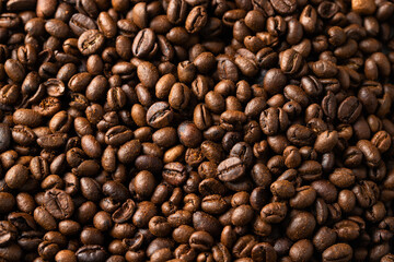 Roasted coffee beans texture background. Close up of detail