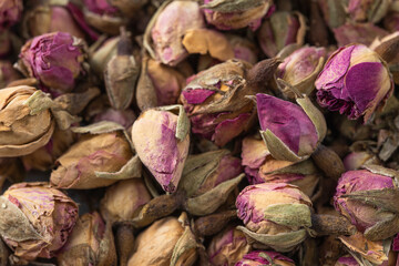 Dried rose buds background. Close up of texture