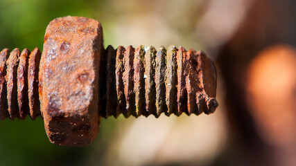 rusty nut. Rusty iron rod with screw threads. Rusted mechanical components. threaded bolt and nut isolated close up. dismantling concept, difficult to unscrew, non-removable. selective focus