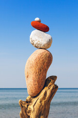 Balance pebbles on the clear blue sky background. Concept of harmony, balance and meditation.