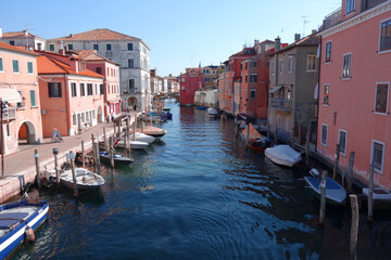 Fototapeta na wymiar Canal Vena in Chioggia, Italy, Venezien, houses and boats, Regione del Veneto, summer, 