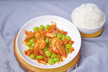 Stir fried Sato and shrimp with curry paste (thai food) in white dish put
