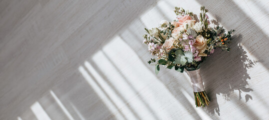 Wedding bouquet of peonies flowers on the floor of the newlyweds