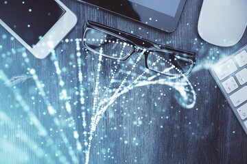 Double exposure of DNA drawing over table with phone. Top view. Science education concept.