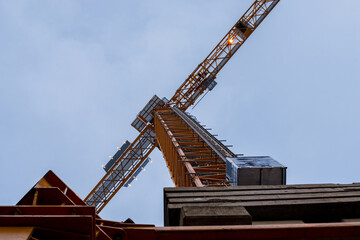 Fototapeta na wymiar Close-up detail of a construction crane, seen from below