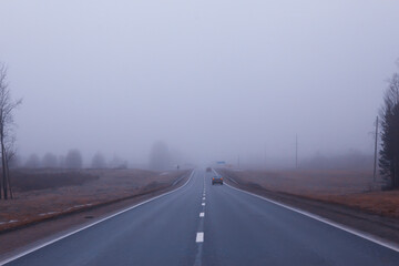 abstract winter road fog snow, landscape view in november transport