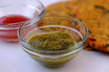 Green Mint Chutney Made with Coriander, pudina And Spices.