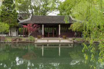 Fototapeta na wymiar Traditional Buildings and Lake in Ke Yuan, Classical Chinese Garden of Suzhou