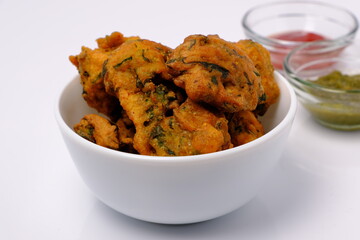 Indian snack pakora with tomato sauce or chutney