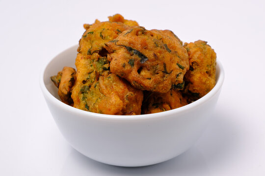 Indian snack pakora in white ceramic bowl