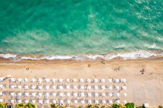 Aerial top view on the beach of Belek, Turkey. Umbrellas, sand and mediterranean sea