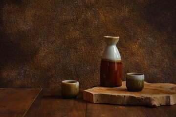 Fototapeta na wymiar tea set with brown background on a wooden table