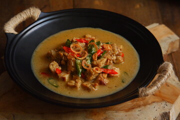 a bowl of tempeh cooked in coconut milk and spices named jangan ndeso in Bahasa