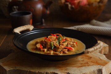 a bowl of tempeh cooked in coconut milk and spices named jangan ndeso in Bahasa