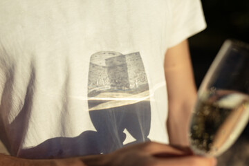 Couple celebrating anniversary on the beach with champagne glasses