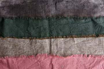 Linen fabric of different colors. Textile background. Linen is pink, gray and green.