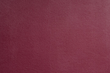 Crimson fine texture of genuine leather. Natural expensive products