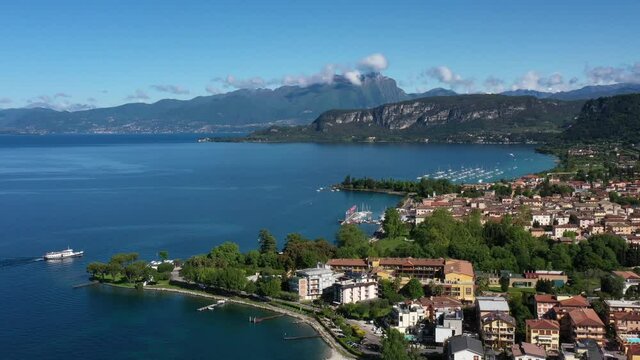 Panorama of the historic town of Bardolino. Top view of the historic part of the city of Bardolino on the coastline of Lake Garda. Aerial view of Bardolino, Lake Garda, Italy.	