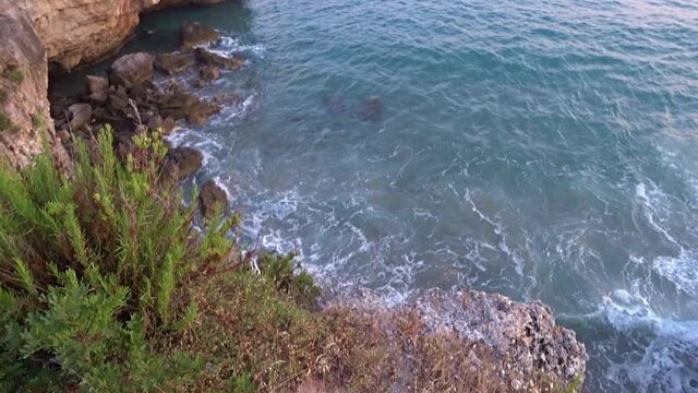 Cliffside and rocks along Calanca cove, Marina di Camerota, Italy, Europe.