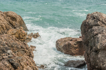 Waves crashing on the rocks.