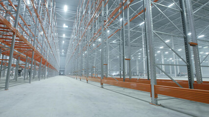 Empty shelves in large industrial storehouse