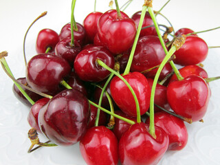      fresh cherries in a white plate