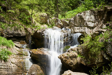 Waterfall in forest and mountain