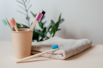 Zero waste bamboo toothbrushes in paper cup, dental care with zero waste concept, sustainable...