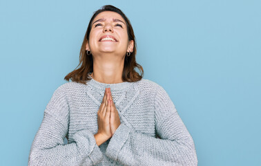 Young caucasian girl wearing casual clothes begging and praying with hands together with hope expression on face very emotional and worried. begging.