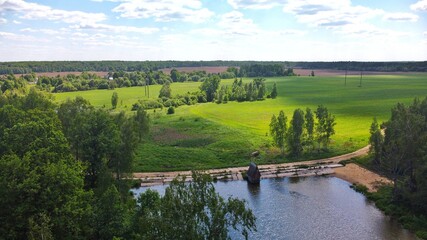 Fototapeta na wymiar Russian field with pond