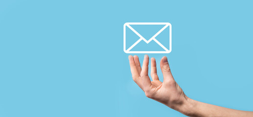 Male hand holding letter icon,email icons .Contact us by newsletter email and protect your personal...