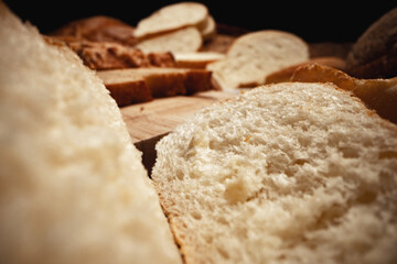 Cut bread assortment for a background, close up