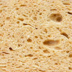 background texture of baked porous bread close-up