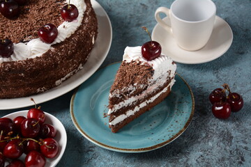 Black forest cake, Schwarzwald pie, dark chocolate and cherry dessert . Black forest cake decorated with whipped cream and cherries.