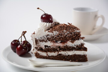 Black forest cake, Schwarzwald pie, dark chocolate and cherry dessert on a white background. Black...