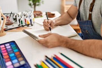 Artist man painting at art studio.
