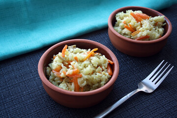 Flavorful pilaf of rice, carrots and chicken.
