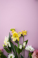 Obraz na płótnie Canvas Flowers bouquet on pink surface