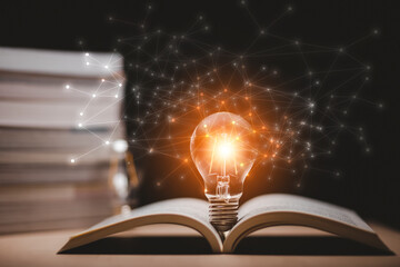 Thinking and creative concept, Light bulb on the Book and light bulb style bokeh vintage dark...