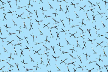 Background of black scissors. professional hairdresser black scissors isolated on blue. Black barber scissors, close up. pop art background, for prints or posters. not seamless pattern