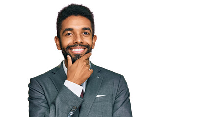 Young african american man wearing business clothes looking confident at the camera smiling with crossed arms and hand raised on chin. thinking positive.