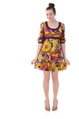 Happy young woman posing in summer dress, looking at camera, smiling. Isolated on white.