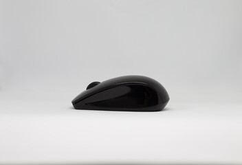 Black computer mouse isolated on white background with copy space.  