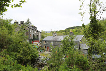 Fototapeta na wymiar A view of historic Welsh slate mine workers cottages in Corris Uchaf, Gwynedd, Wales, UK.